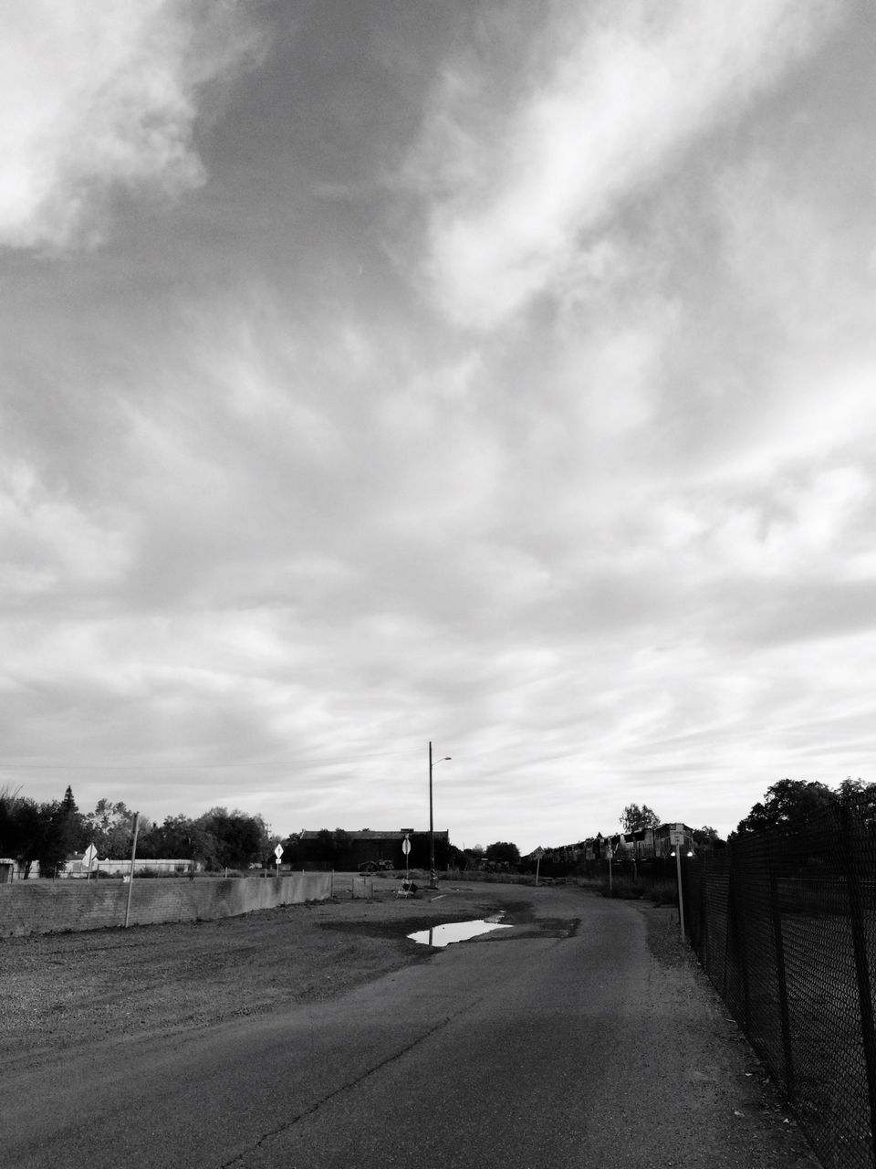 sky, road, the way forward, transportation, cloud - sky, cloudy, street, landscape, cloud, diminishing perspective, dirt road, field, empty, vanishing point, day, country road, built structure, outdoors, nature, tranquility