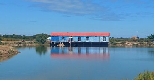 Scenic view of lake against blue sky