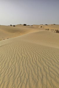 Scenic view of desert against clear sky