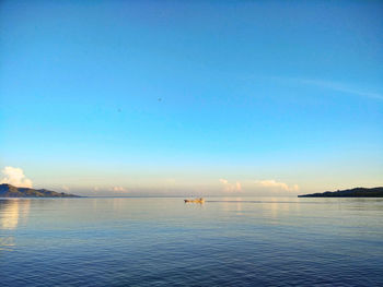 Scenic view of sea against sky at sunset