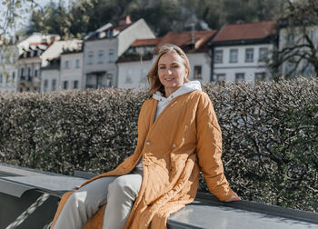 A beautiful young stylish woman walking in the city. spring mood