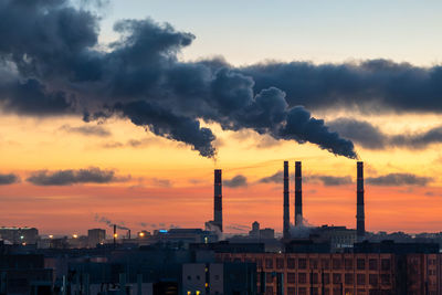 Cityscape against sky during sunset