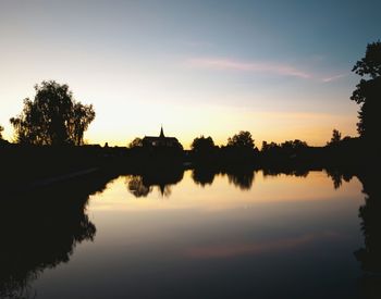Reflection of trees in calm lake