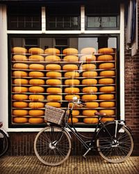 Stack of firewood in basket on building