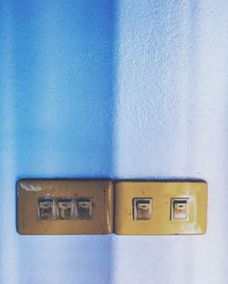 Close-up of light switch on wall