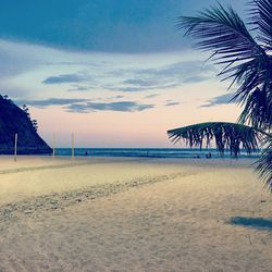 View of beach against cloudy sky