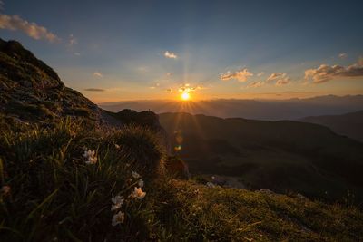 Scenic view of mountains against sky during sunset