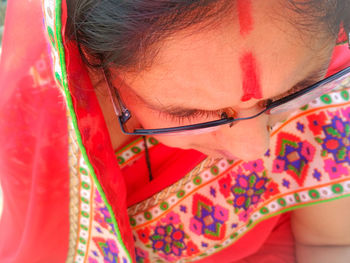 Close-up of mature woman wearing sari and bindi