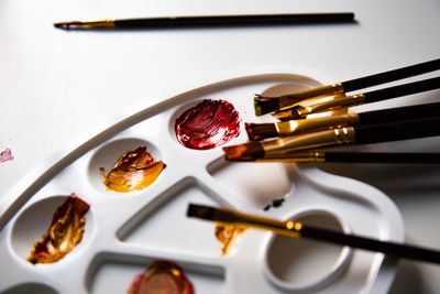 High angle view of paintbrushes on table