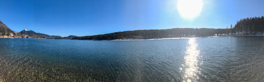 Panoramic view of sea against sky on sunny day