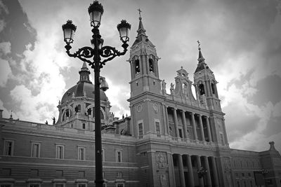 Low angle view of church against cloudy sky