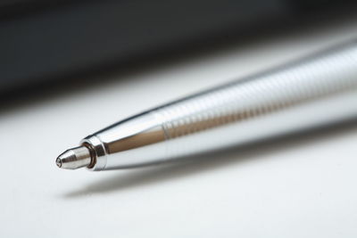 Close-up of pen on white background