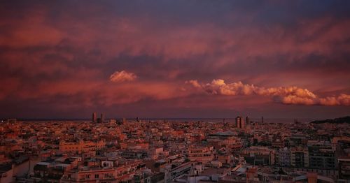 High angle shot of townscape against sky at sunset