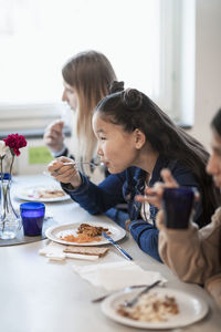 Girl eating lunch school canteen