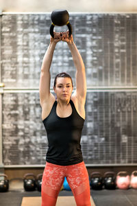 Young woman exercising at gym