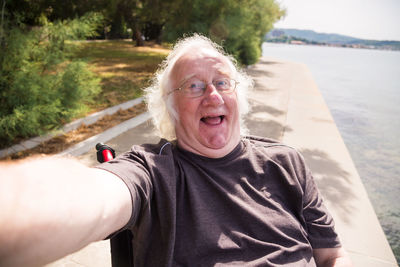 Portrait of young man photographing