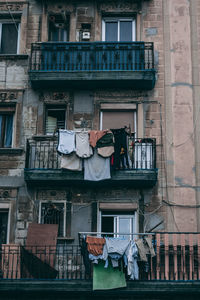 Low angle view of clothes drying on building