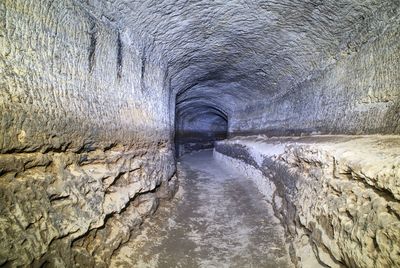 The old sandstone water tunnel, mined caves. the cave. sandstone tunnel moistened walls. dry channel