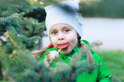 Portrait of cute girl eating lollypop