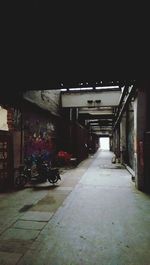 Empty road along buildings