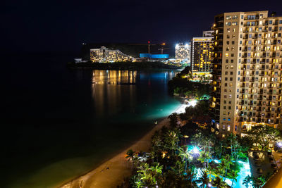 Illuminated buildings at waterfront