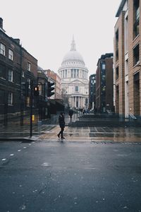 Man walking on street in city