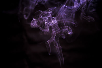 Close-up of smoke against black background