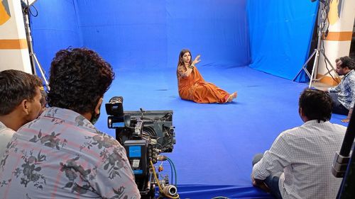 Rear view of people photographing on stage