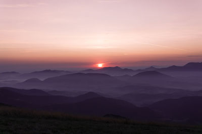 Sunset behind mountains landscape