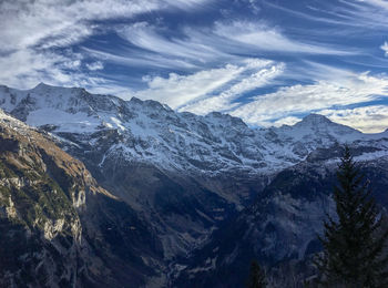 Scenic view of snowcapped mountains against sky