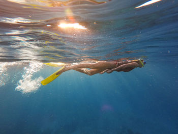 Woman swimming in sea