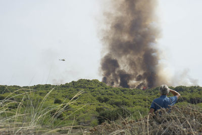 Man on field against sky