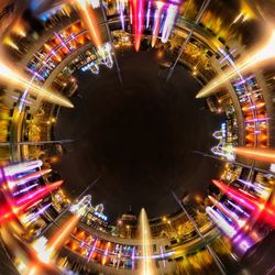 Light trails on illuminated city at night