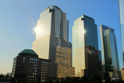 Low angle view of skyscrapers against clear sky