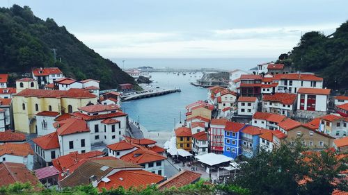 High angle view of townscape by buildings against sky