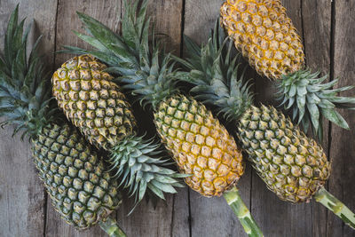 Fresh pineapples on the dark background