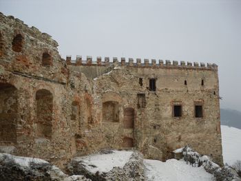 Old ruins against clear sky during winter