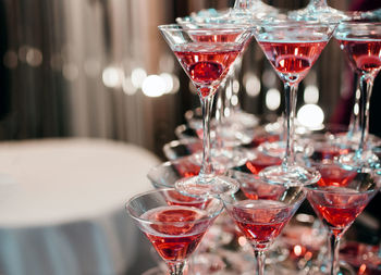 Close-up of wine glasses on table