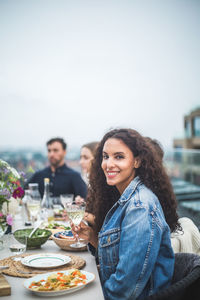 Young couple sitting on table