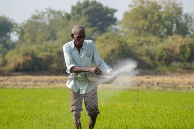 Full length of man standing on field