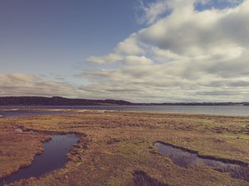 Scenic view of beach against sky