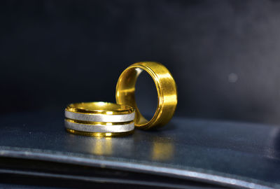 Close-up of wedding rings on table