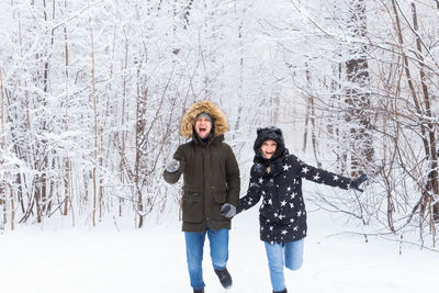 Full length of woman on snow covered land