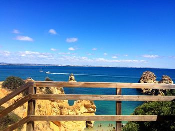 Scenic view of sea against blue sky