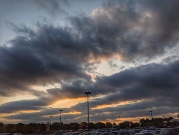 Low angle view of storm clouds over city