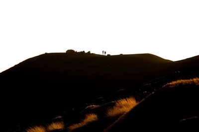 Scenic view of silhouette mountain against clear sky