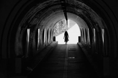 People walking in tunnel