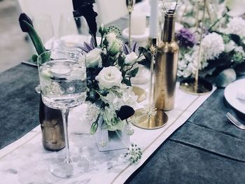 Flowers in glass vase on table