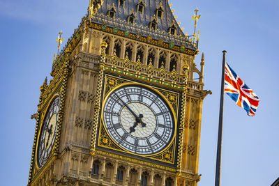 Low angle view of clock tower against sky