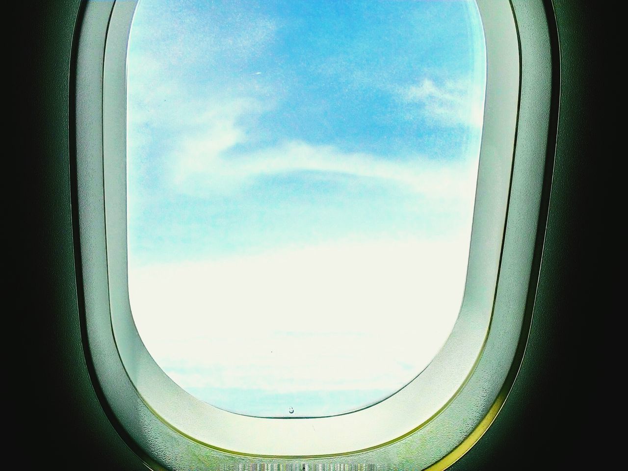 transportation, window, sky, airplane, indoors, vehicle interior, glass - material, mode of transport, transparent, air vehicle, cloud - sky, part of, public transportation, cloud, day, cropped, travel, no people, aerial view, journey